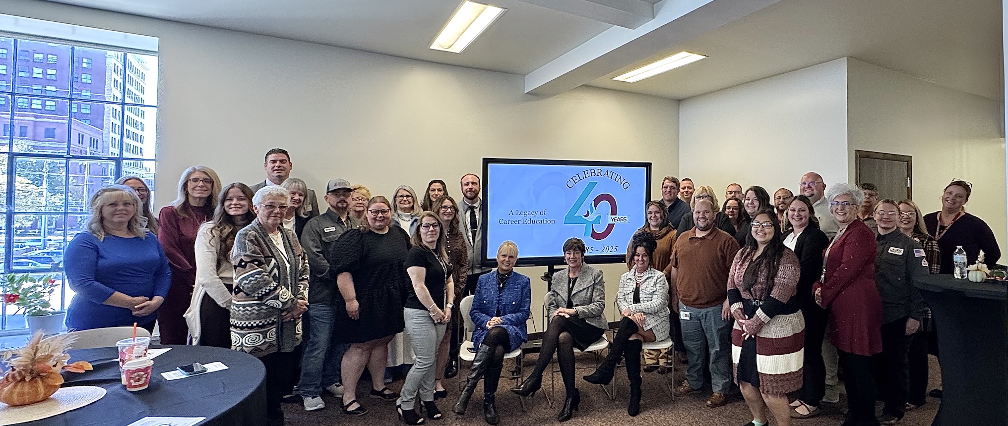 Laurel Faculty and Staff pause for a photo with Nancy and Doug Decker to commemorate this milestone for the institution.