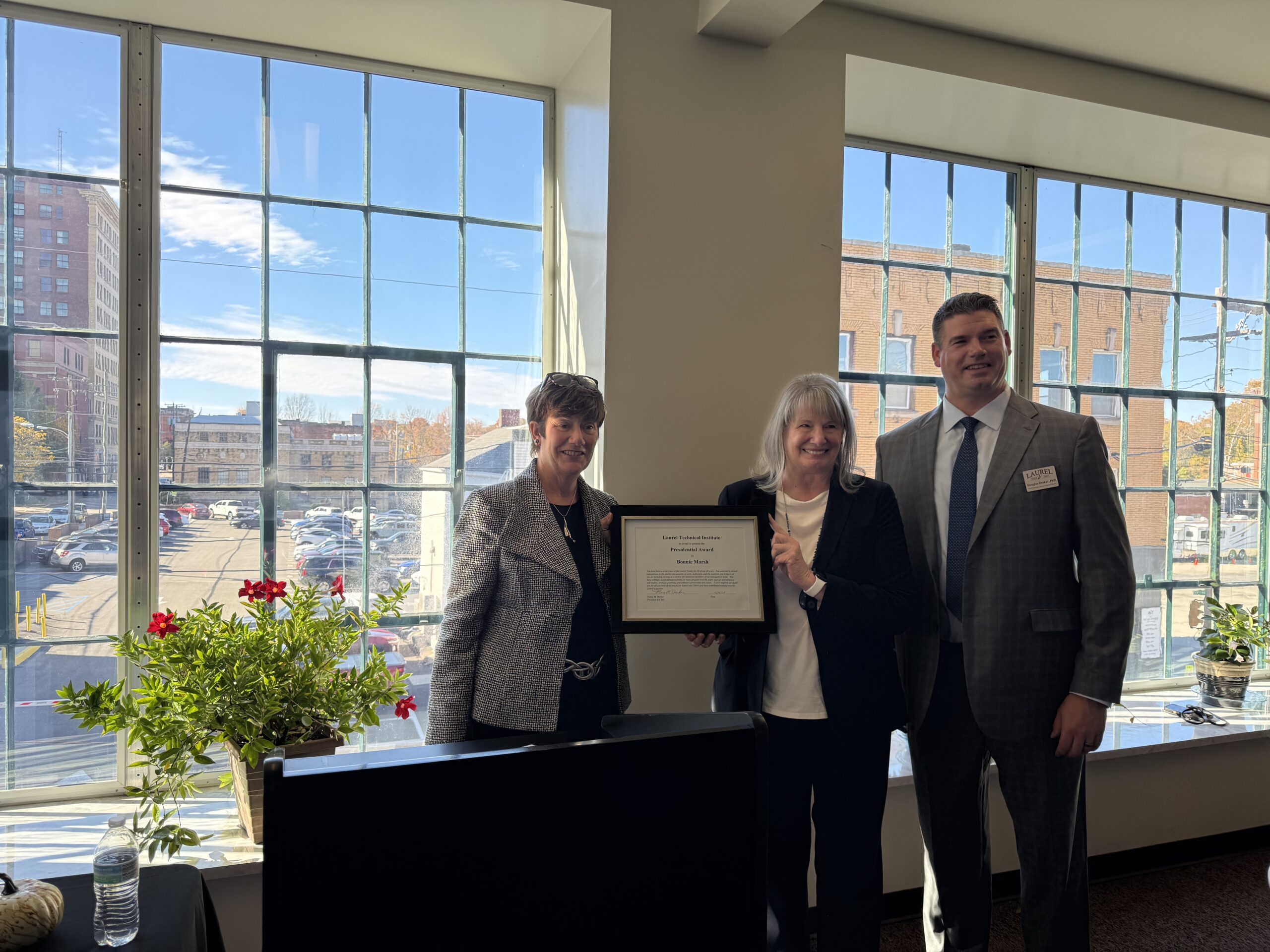 Nancy Decker presents the Presidential Award to 30 year veteran of Laurel, Bonnie Marsh, Vice President of Institutional Effectiveness and Executive Director.